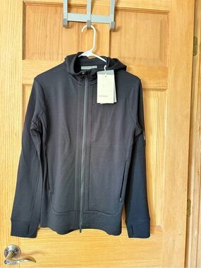 Icebreaker 100% merino wool. 
Women's Black Quantum Hoodie NWT